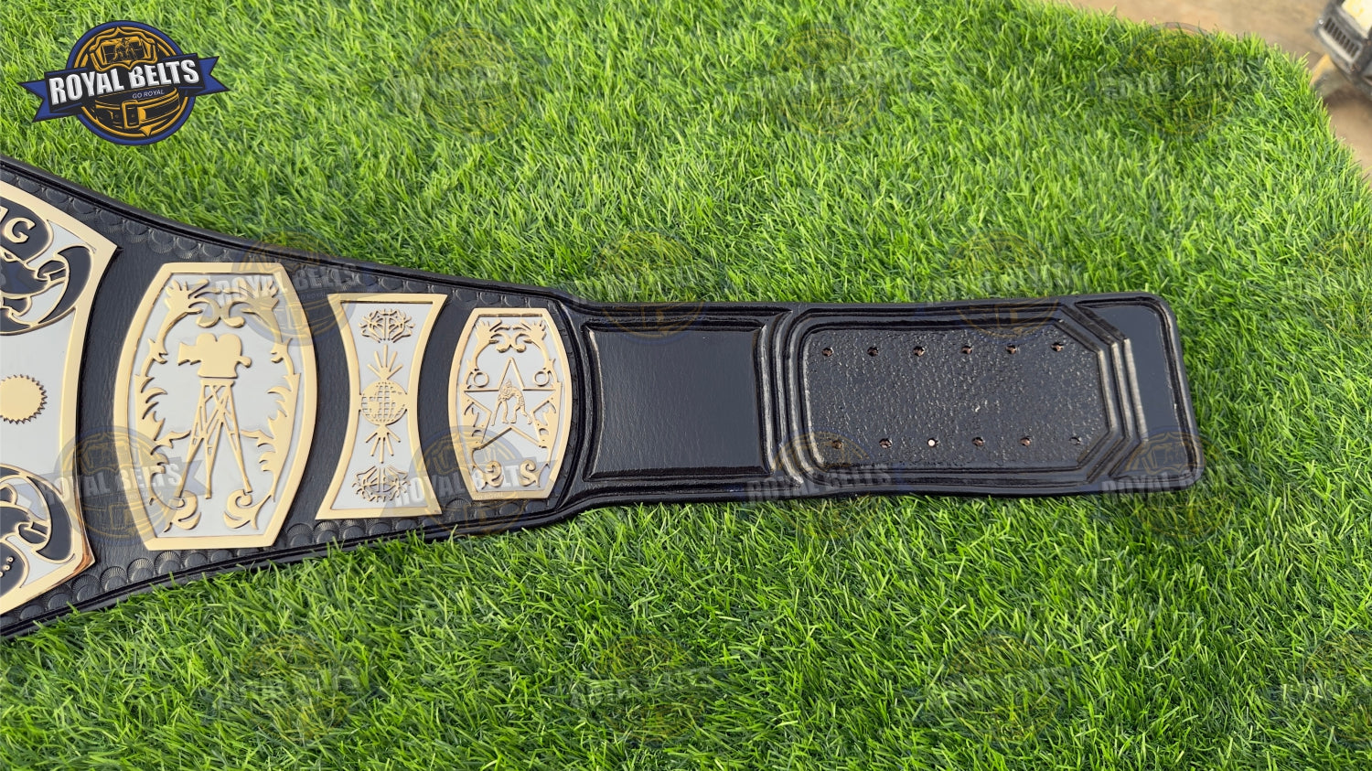 UWF HD CNC title belt with mirror polished center plate, raised Universal TV emblem, black leather strap