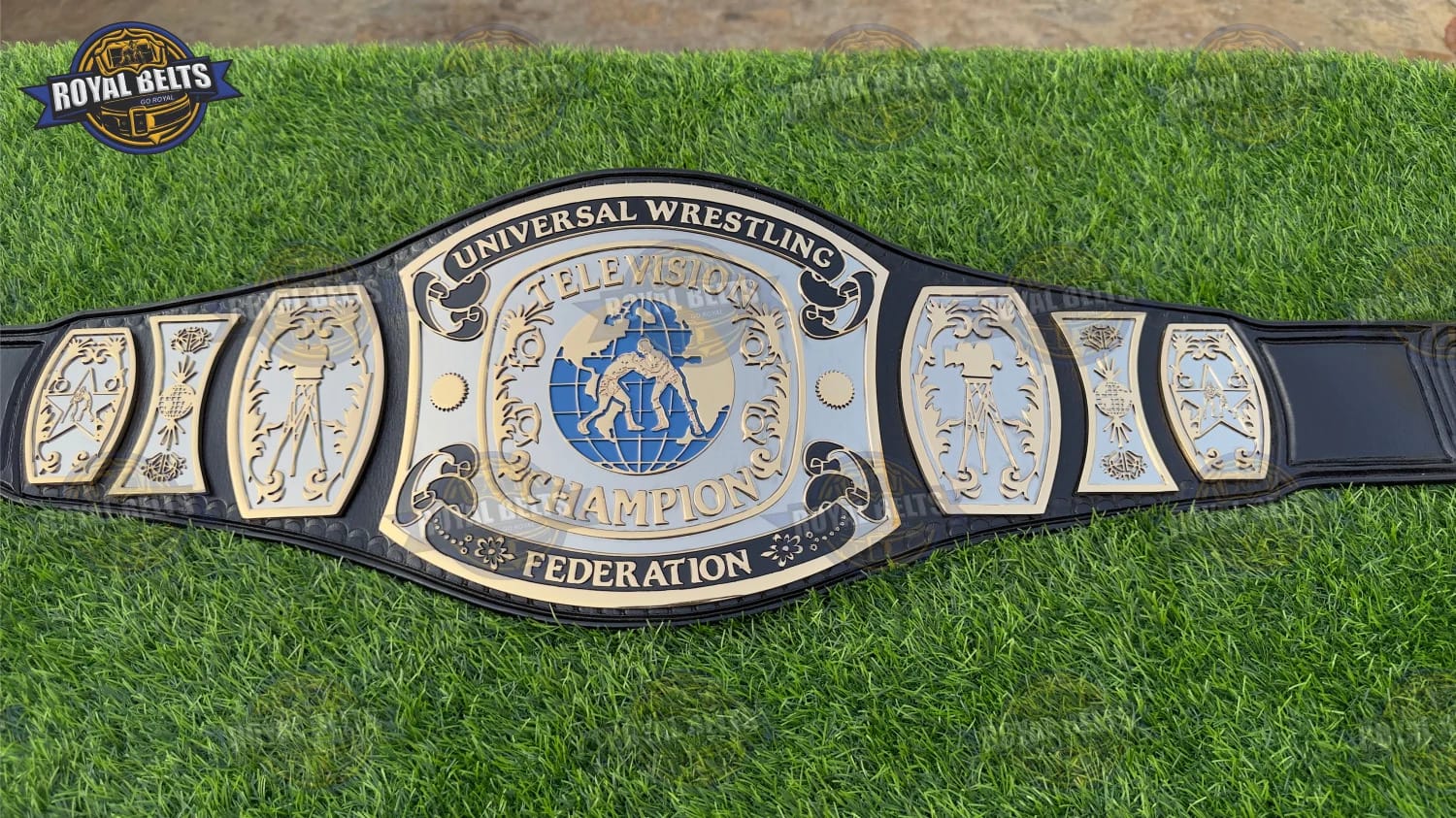 UWF Universal TV championship belt with layered dual plates, high gloss finish, reinforced leather backing