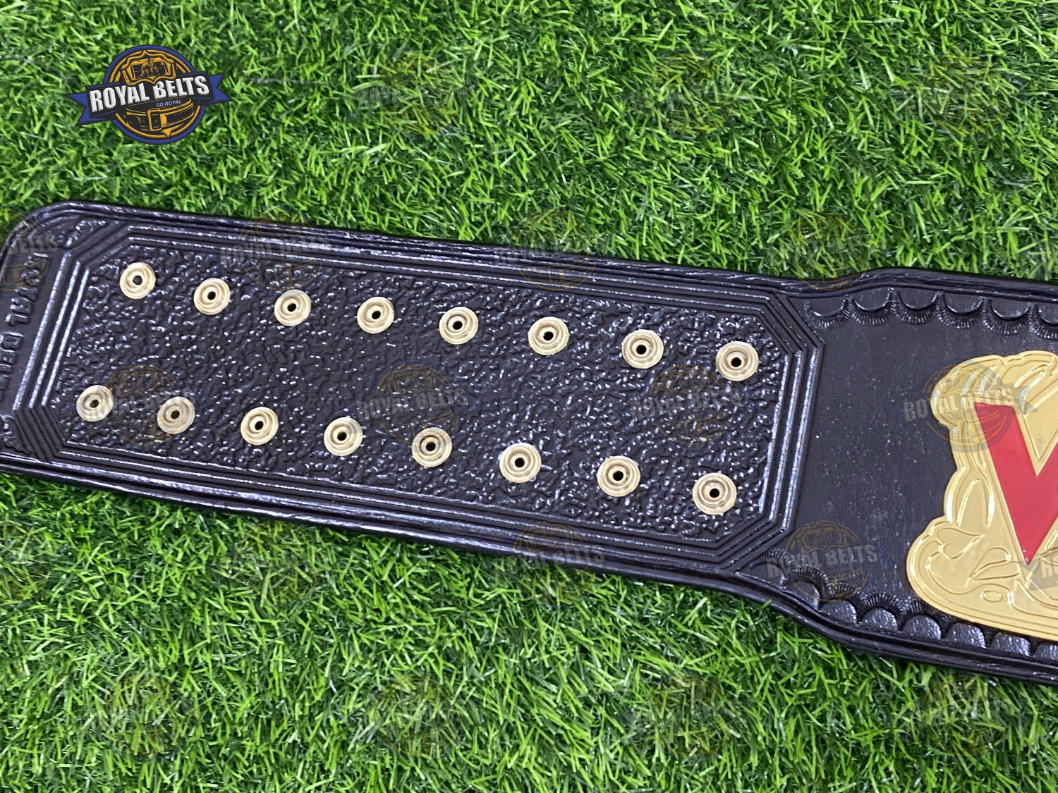 WCW belt with bold embossed center plate, thick alloy metal, black leather strap with reinforced stitching