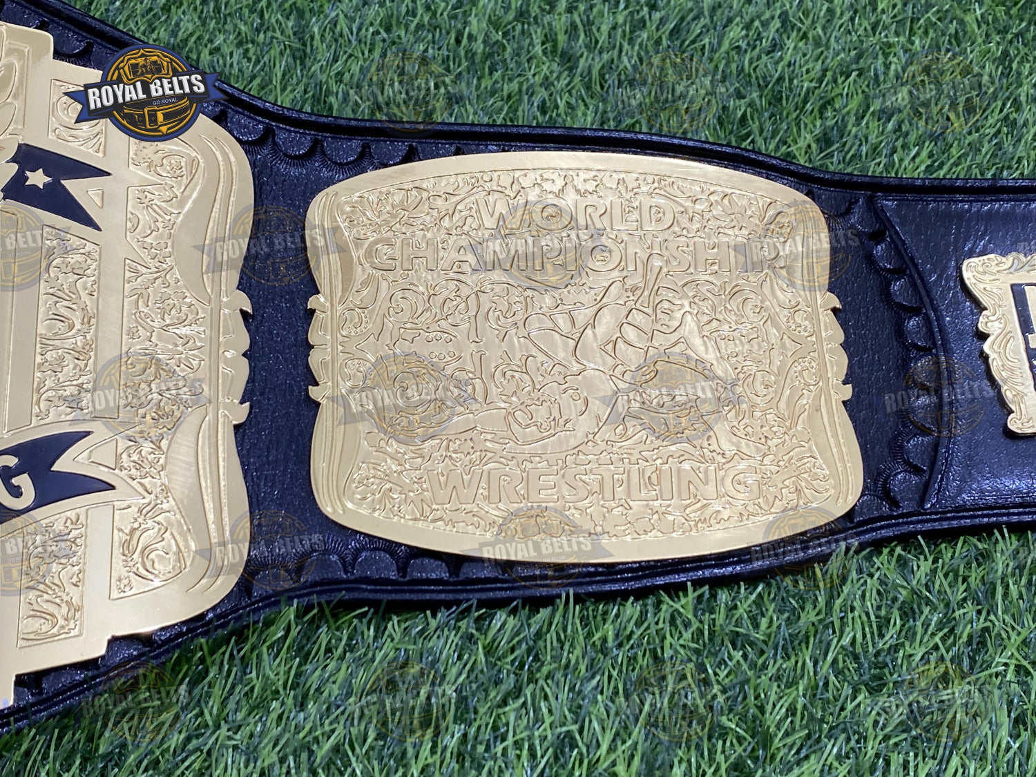 WCW US 3 Plated wrestling belt with raised logo centerpiece, polished zinc, reinforced leather backing