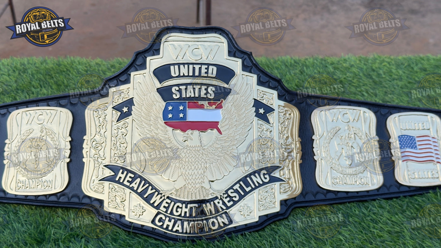 WCW belt with oversized gold center plate, mirror polished finish, engraved side plates, black leather strap