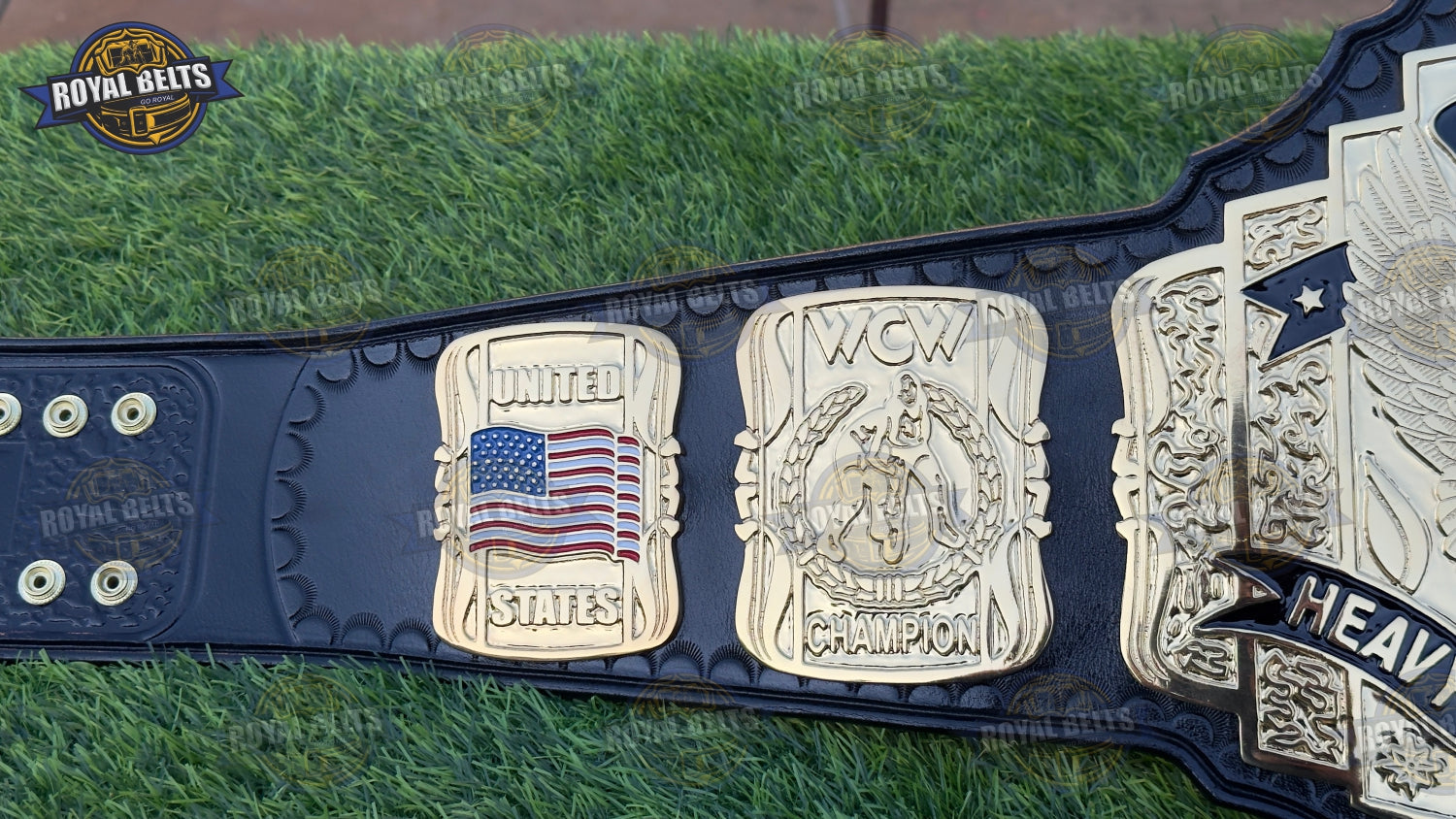 WCW United States belt displaying bold embossed center plate, thick alloy metal, black stitched leather strap 