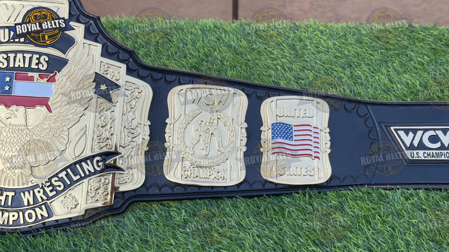 Custom WCW US title belt with mirror polished gold plates, reinforced black leather backing, engraved logos