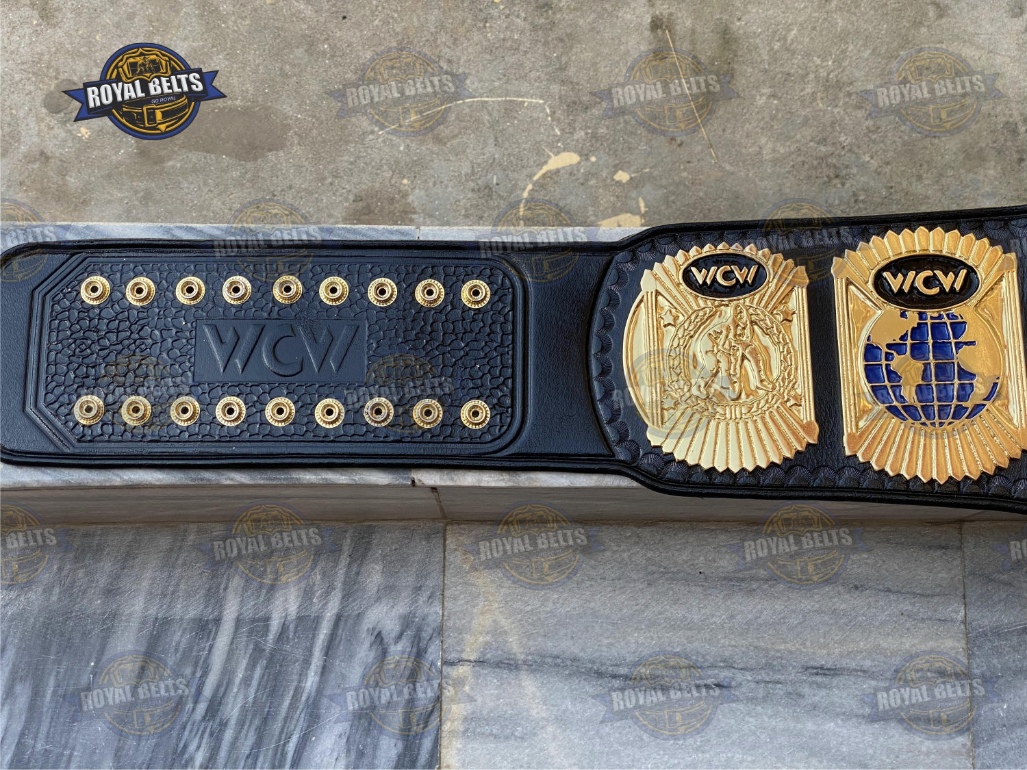 WCW World Wrestling belt with thick embossed center plate, gold alloy, detailed side plates, black leather strap