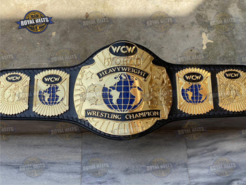 World Championship belt with raised CNC center emblem, mirror polished zinc, thick black leather backing Made by Royal Belts
