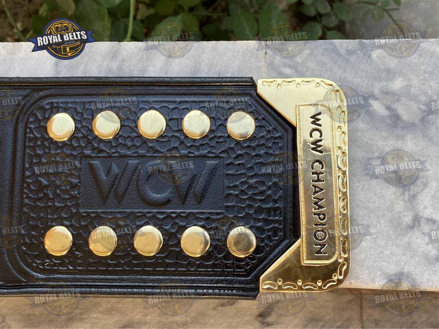 WCW belt with multi layer gold center plate, engraved logos, stitched black leather, polished zinc finish
