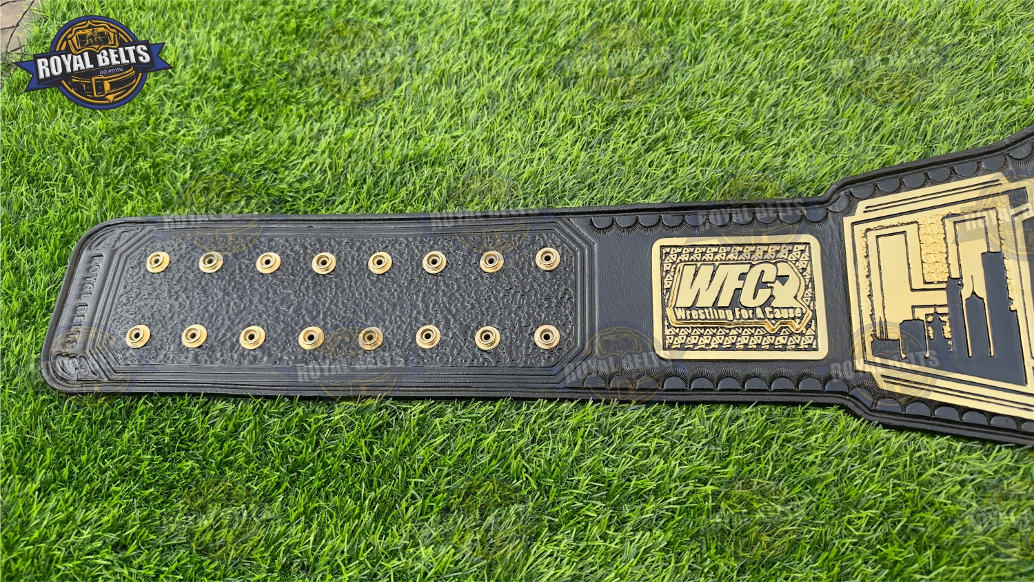 WFC custom title belt with polished gold tone and curved heavyweight metal plates