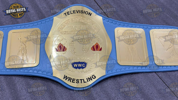 TV wrestling title belt featuring engraved WWC plates, polished brass finish, stitched leather backing Made by Royal Belts