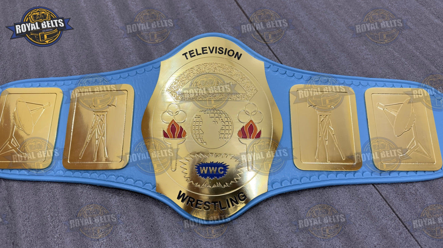 Custom WWC TV championship belt with raised center emblem, mirror polished gold , adjustable leather Made by Royal Belts