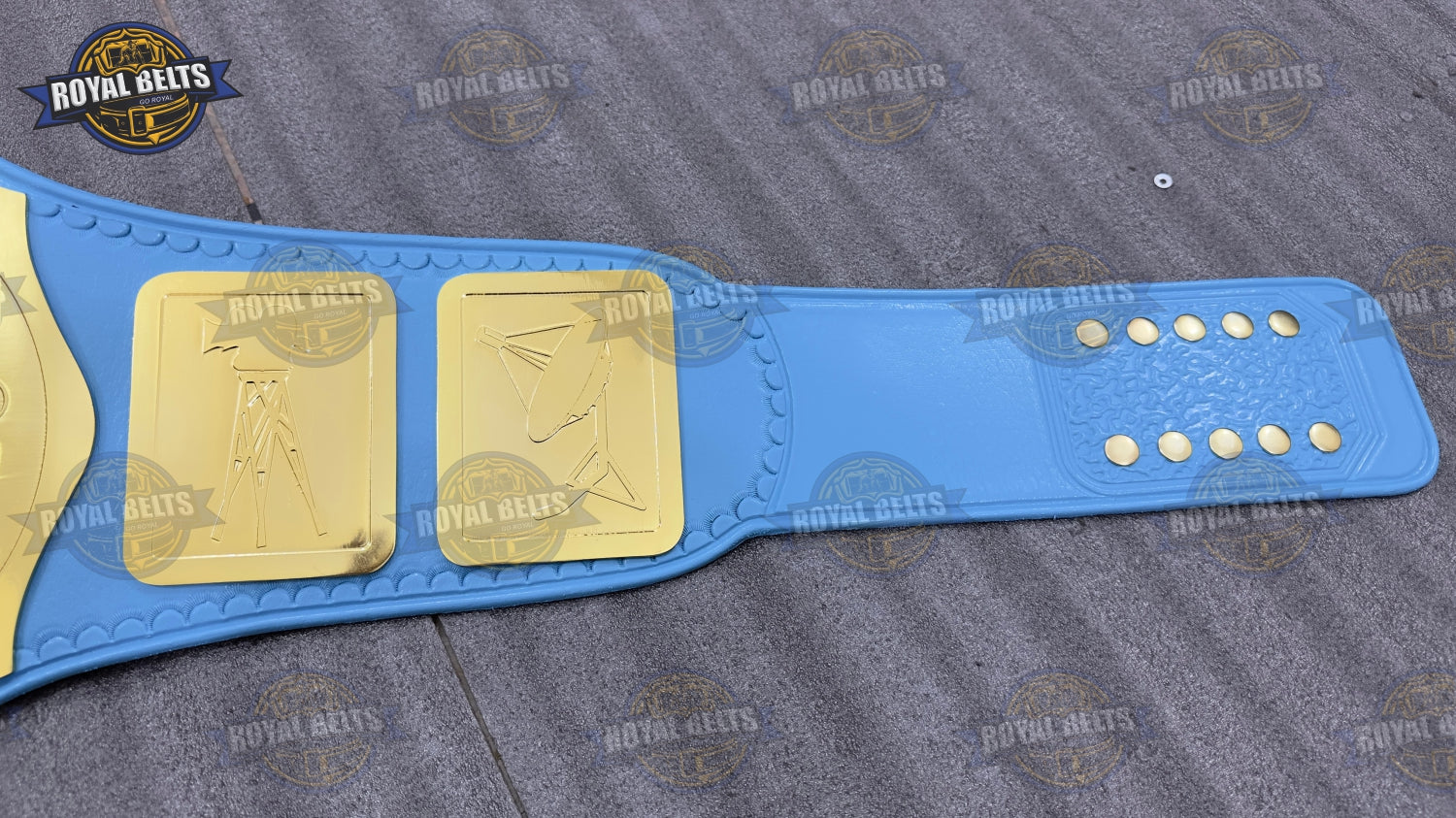 WWC TV championship belt with mirror polished center plate, raised logo, blue leather strap