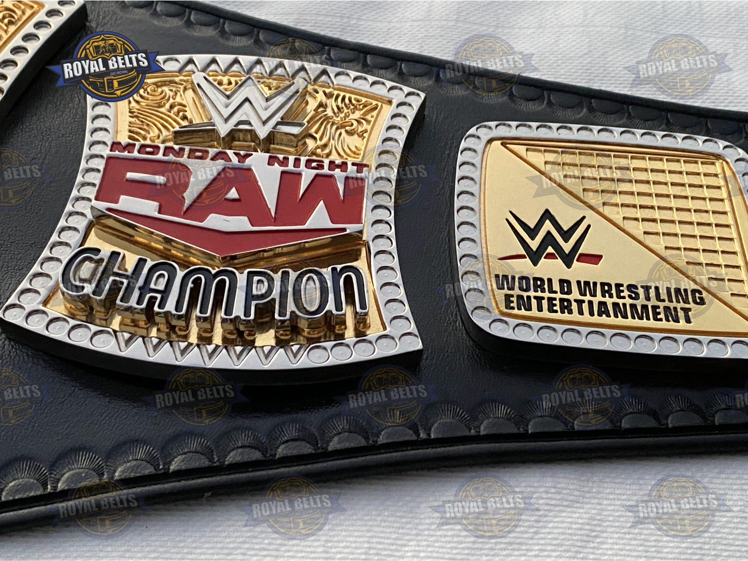 Spinner WWE title belt with bold embossed center, high gloss dual finish, reinforced black leather backing