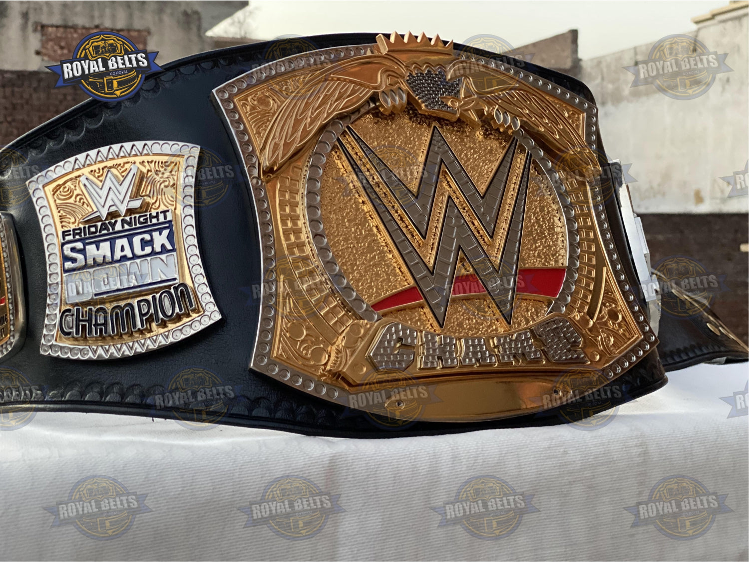 Custom World Heavyweight belt with oversized CNC gold plates, mirror polished finish, stitched leather strap