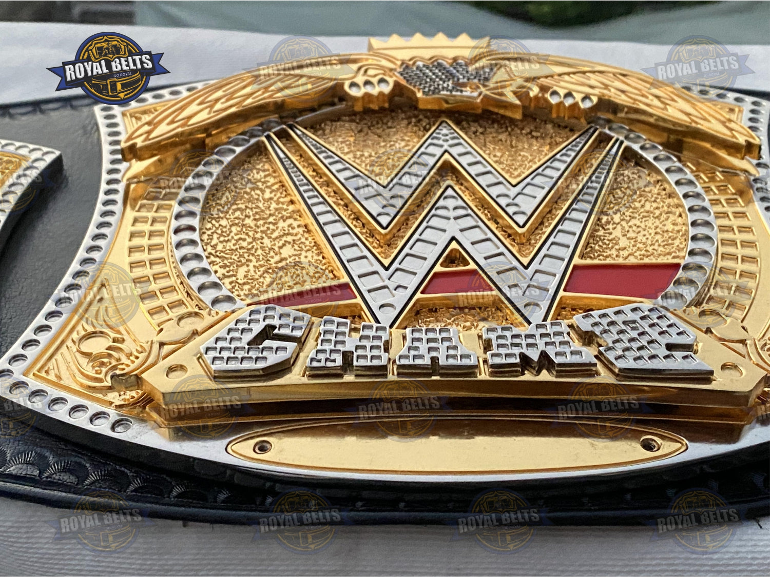 World Heavyweight title belt with multi layer dual center, etched WWE details, reinforced leather backing