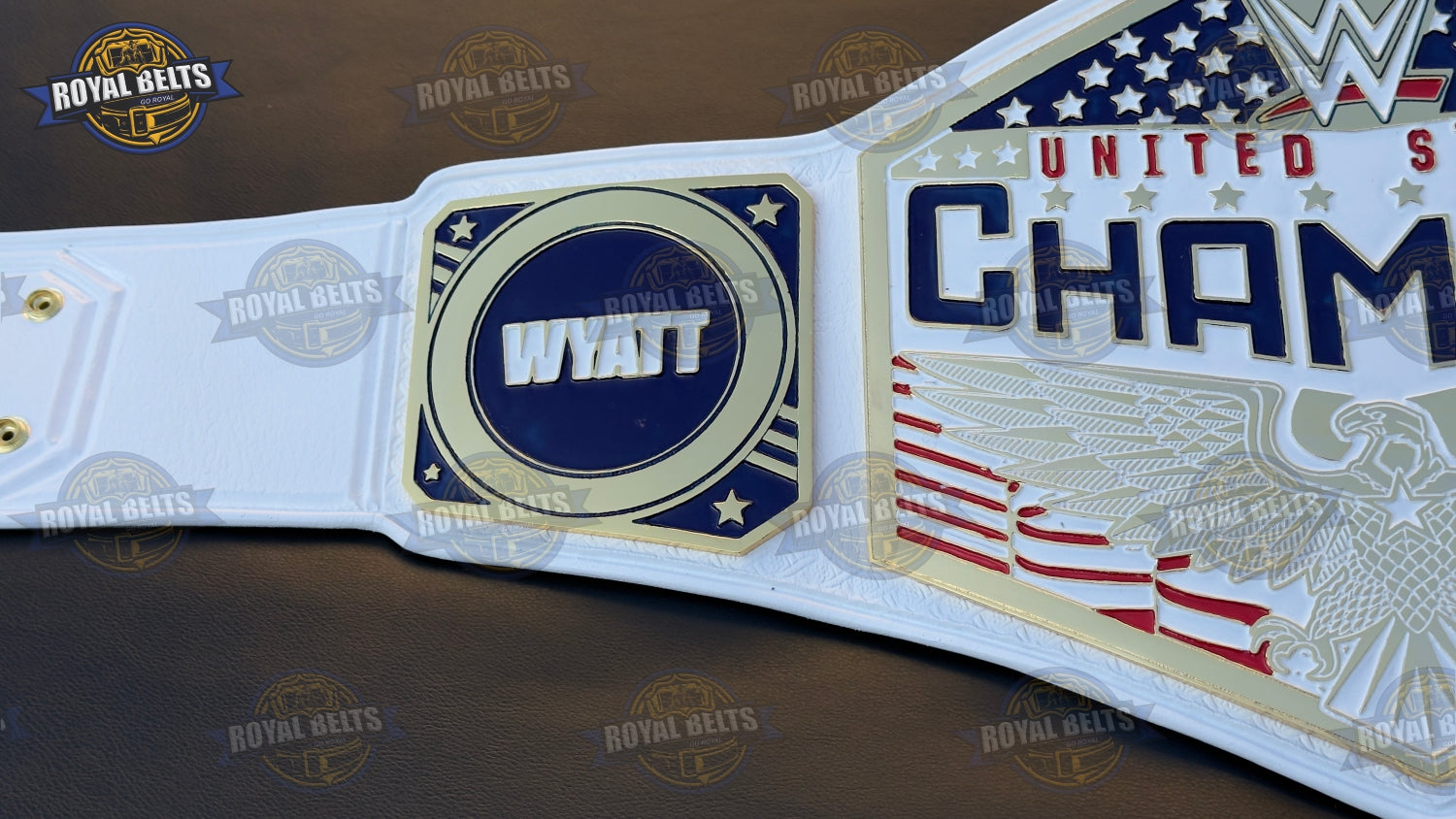 WWE US belt displaying bold embossed center plate, thick metal construction, snap fit leather