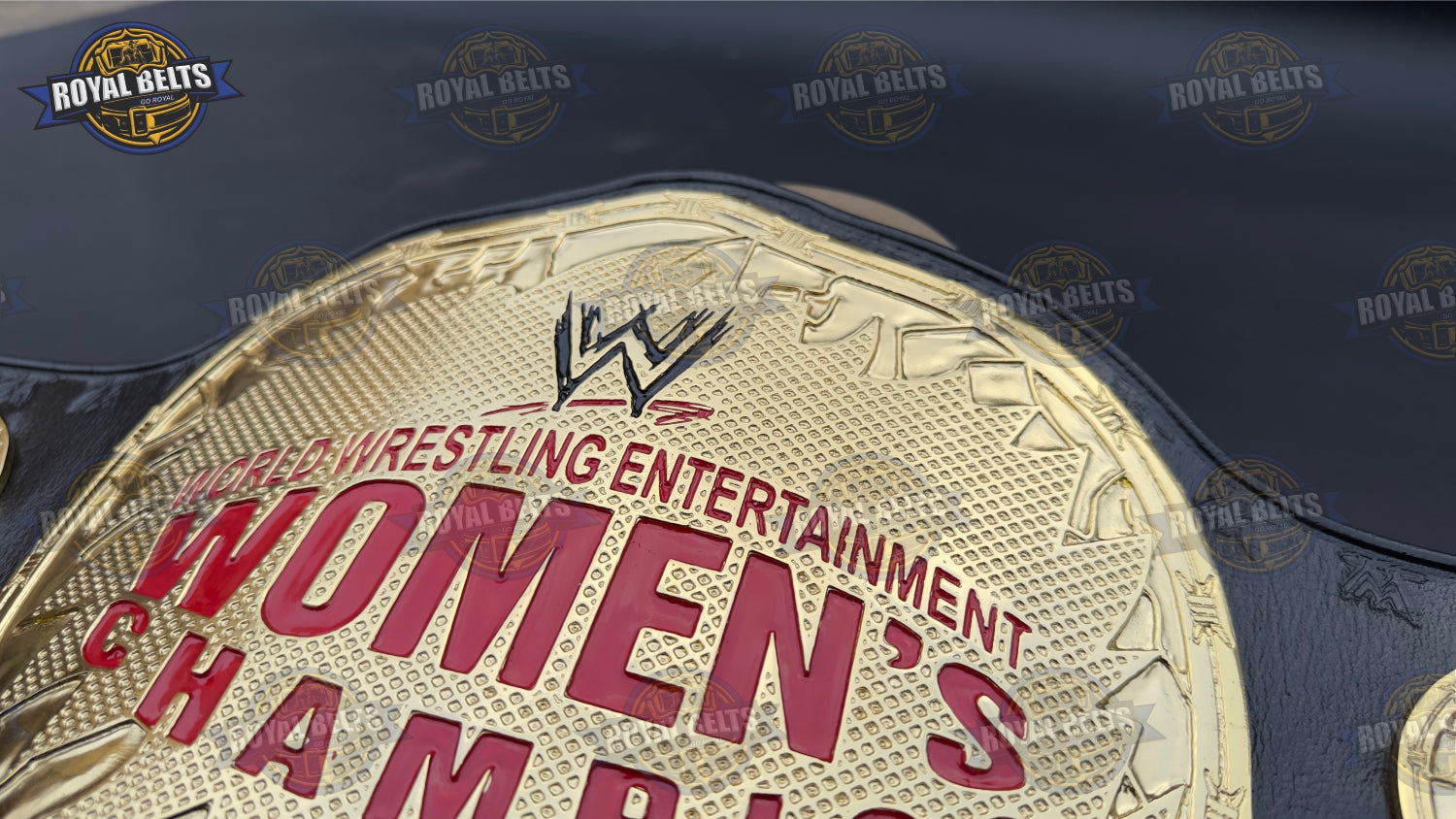 WWE Women’s wrestling belt with mirror polished center plate, raised logo, smooth leather strap