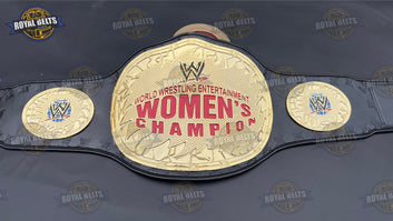 Women’s wrestling title belt featuring engraved side plates, polished zinc finish, stitched leather backing Crafted by Royal Belts