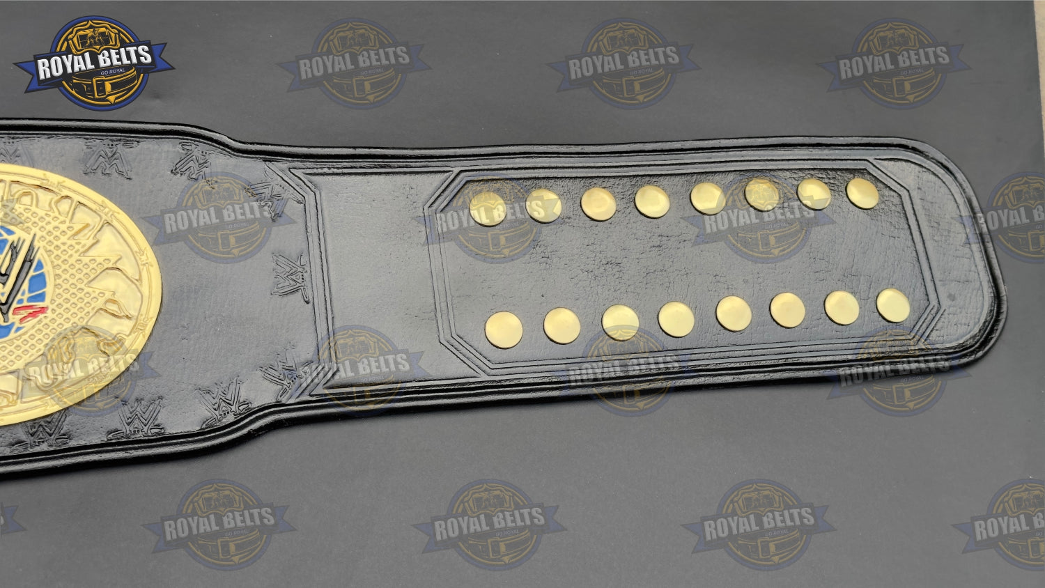 WWE Women’s championship belt with beveled gold plates, smooth polished finish, adjustable leather