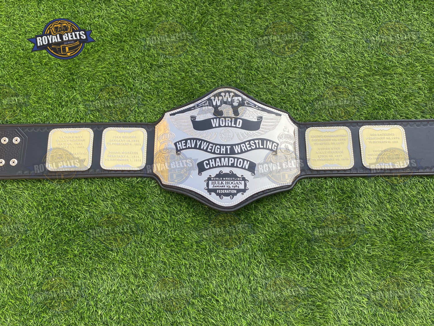 1984 WWF World Heavyweight title belt showing raised lettering and curved metal plates Crafted by Royal Belts