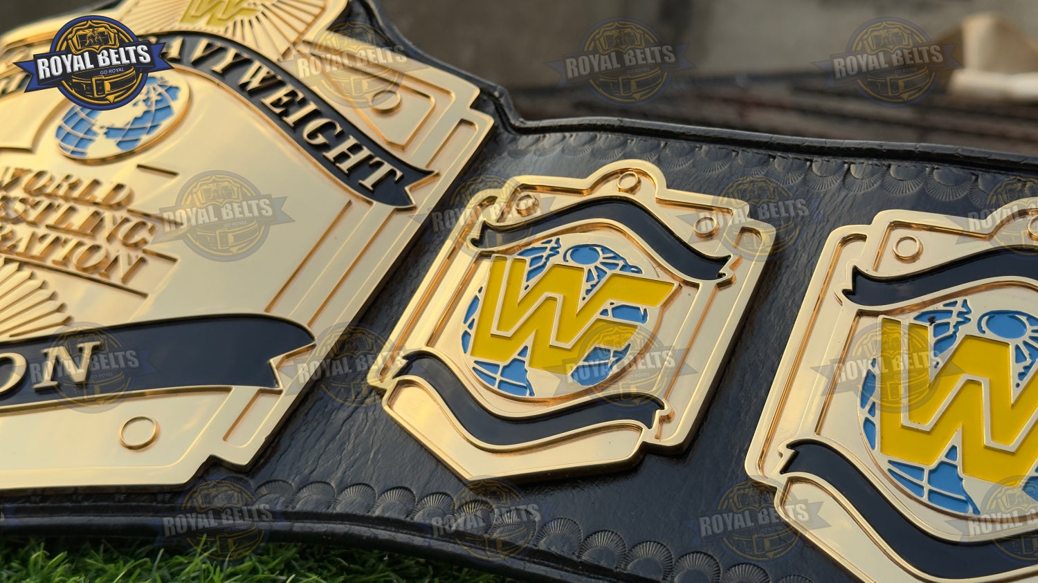 WWF belt with thick embossed HD CNC center plate, layered gold side plates, black stitched leather strap